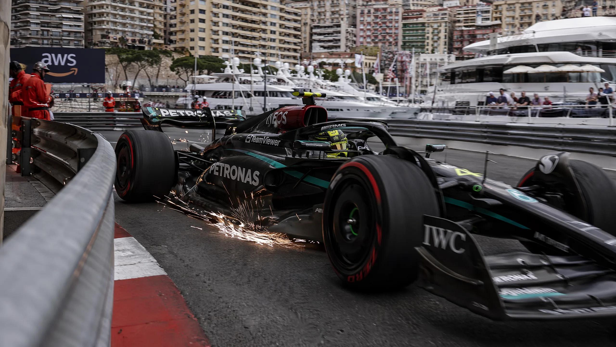 Formula 1 Mercedes car sending sparks flying as it races through the Monaco Gran